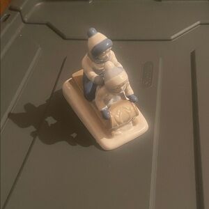 Porcelain Figurine of Children on Sled